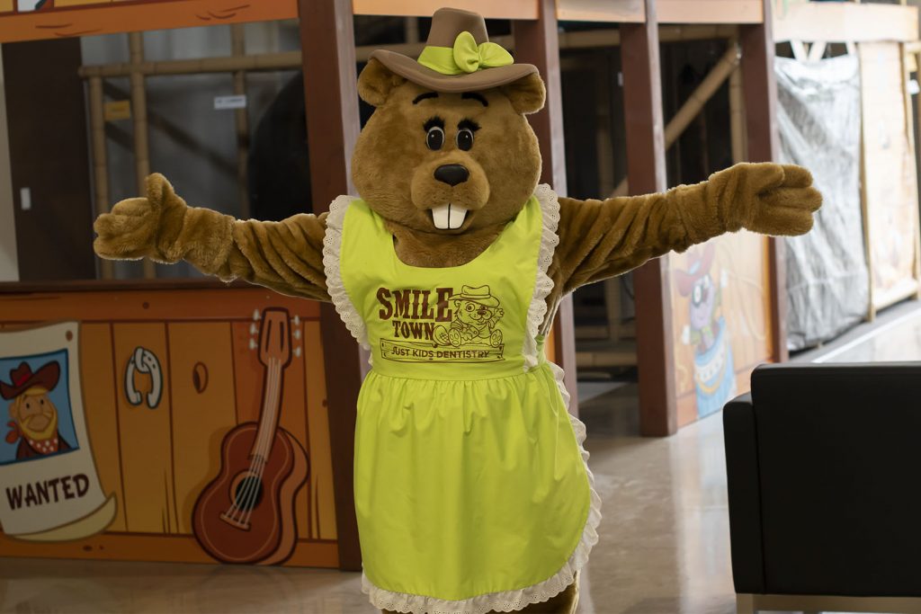 SmileTown mascot welcoming kids