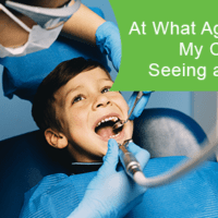 At what age should a child visit a dentist?